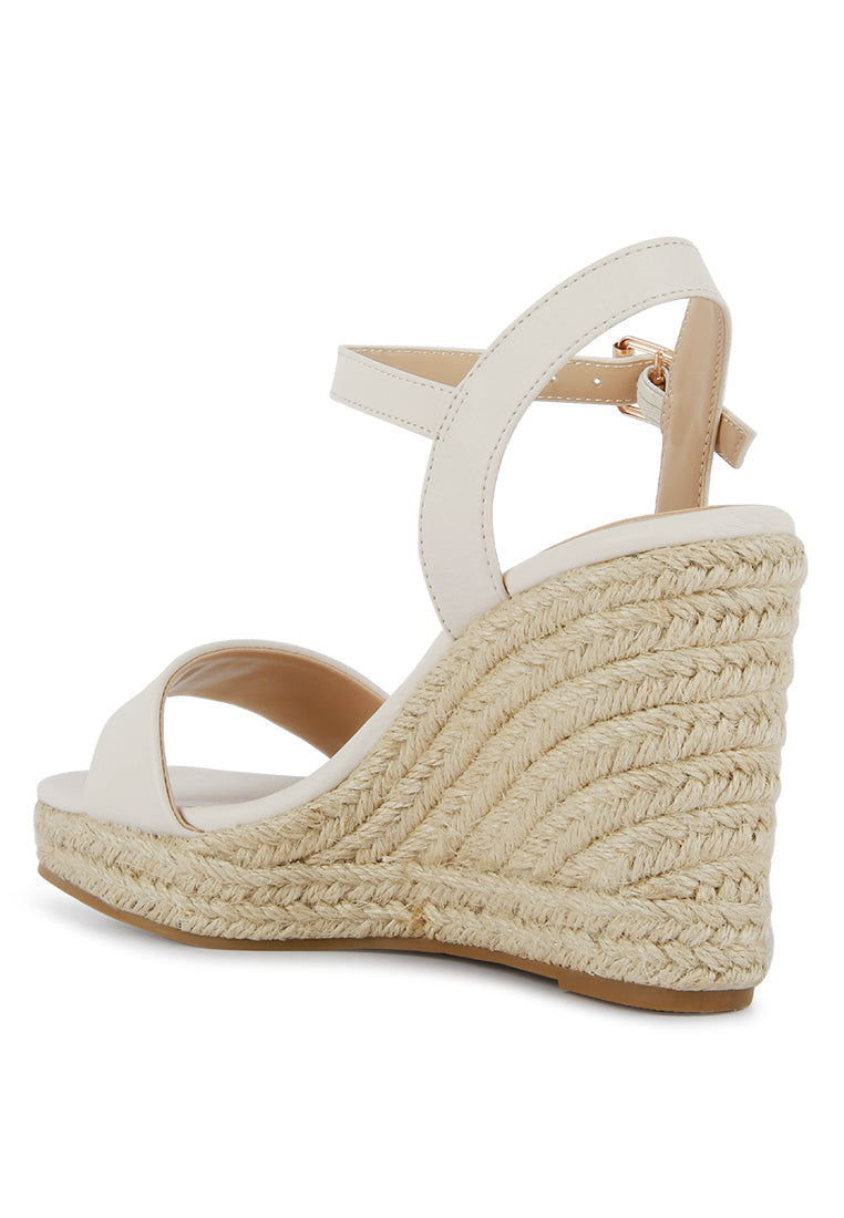 Augie Woven Wedge Sandals featuring a square open toe, metallic pin buckle, and espadrille detail on the wedge.