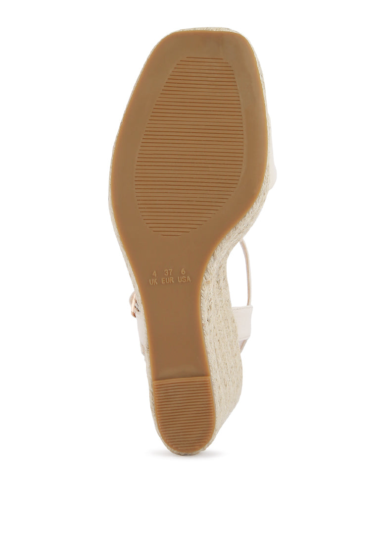 Augie Woven Wedge Sandals featuring a square open toe, metallic pin buckle, and espadrille detail on the wedge.