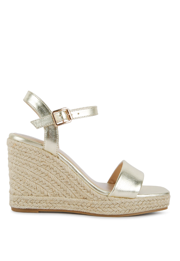 Augie Woven Wedge Sandals featuring a square open toe, metallic pin buckle, and espadrille detail on the wedge.