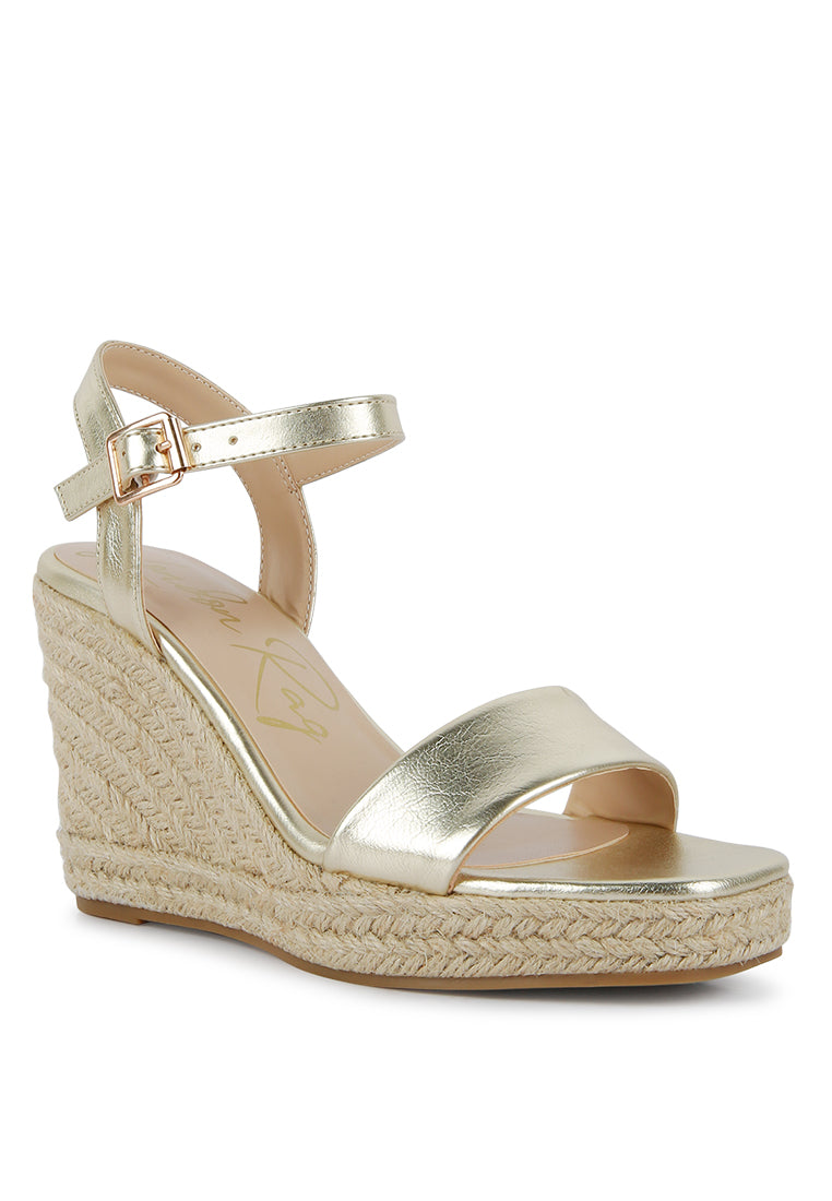 Augie Woven Wedge Sandals featuring a square open toe, metallic pin buckle, and espadrille detail on the wedge.