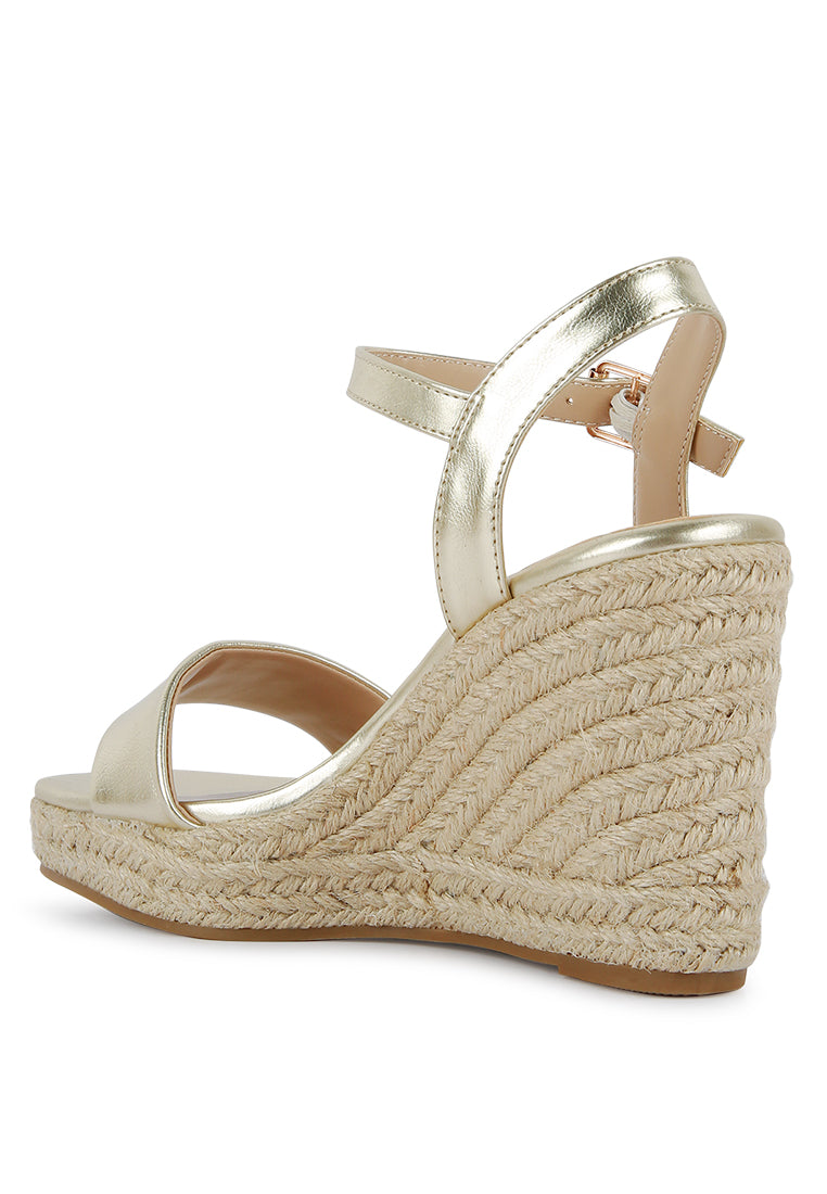 Augie Woven Wedge Sandals featuring a square open toe, metallic pin buckle, and espadrille detail on the wedge.