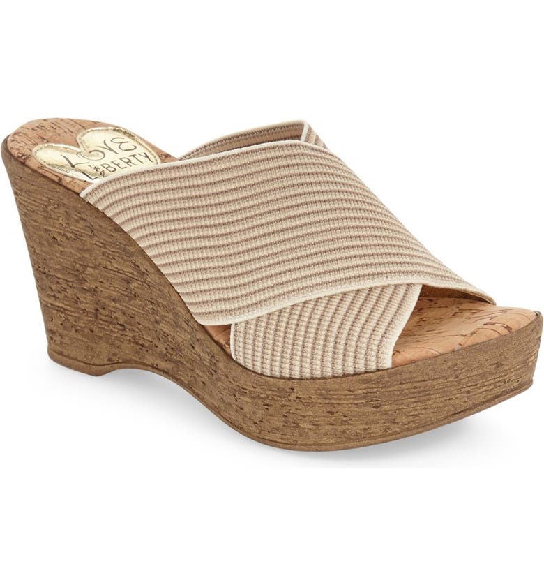 A pair of stylish Beachwalk sandals featuring a stretch gore upper and cork wedge outsole, perfect for summer outings.