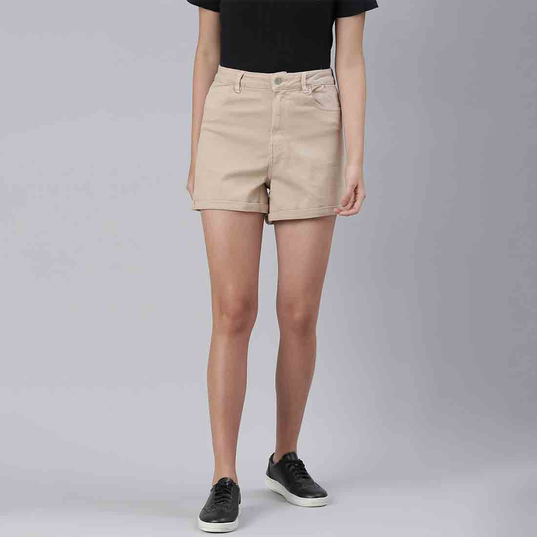 Beige high waist shorts with upturned hem and pockets, showcasing a stylish summer look.