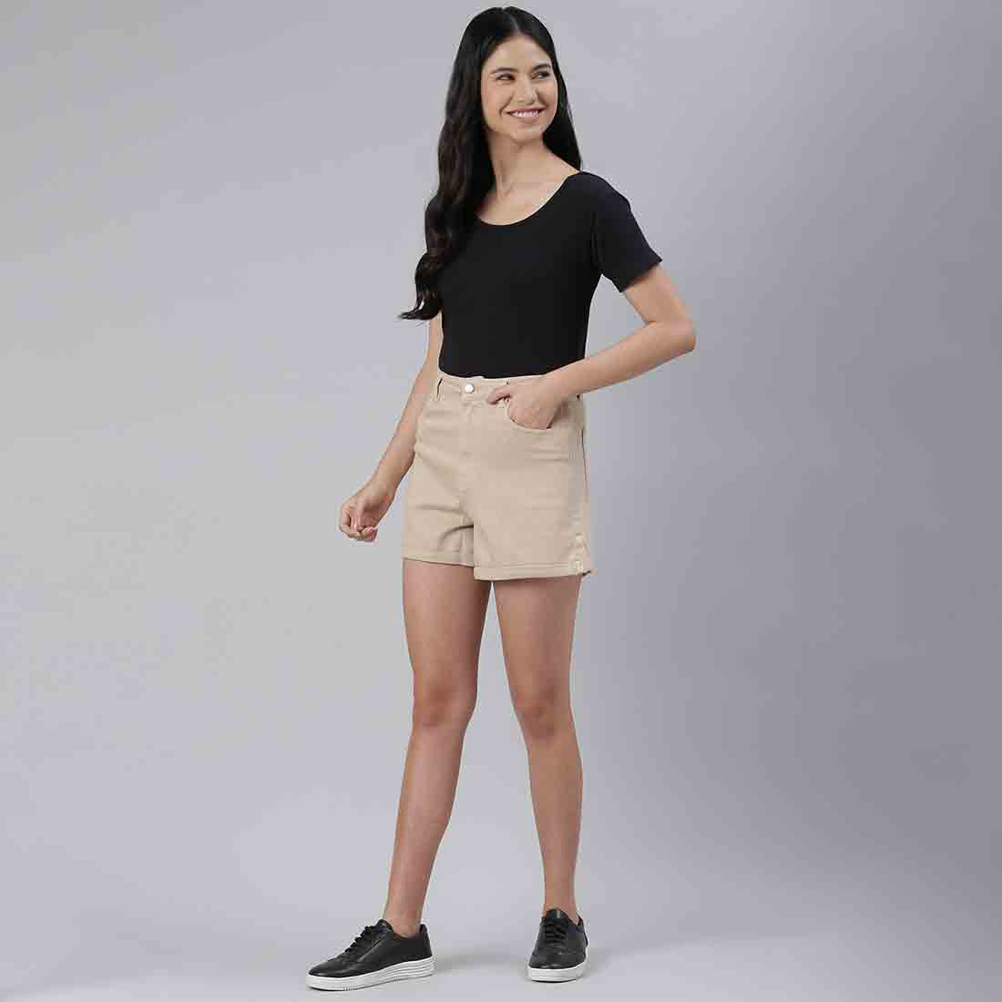 Beige high waist shorts with upturned hem and pockets, showcasing a stylish summer look.