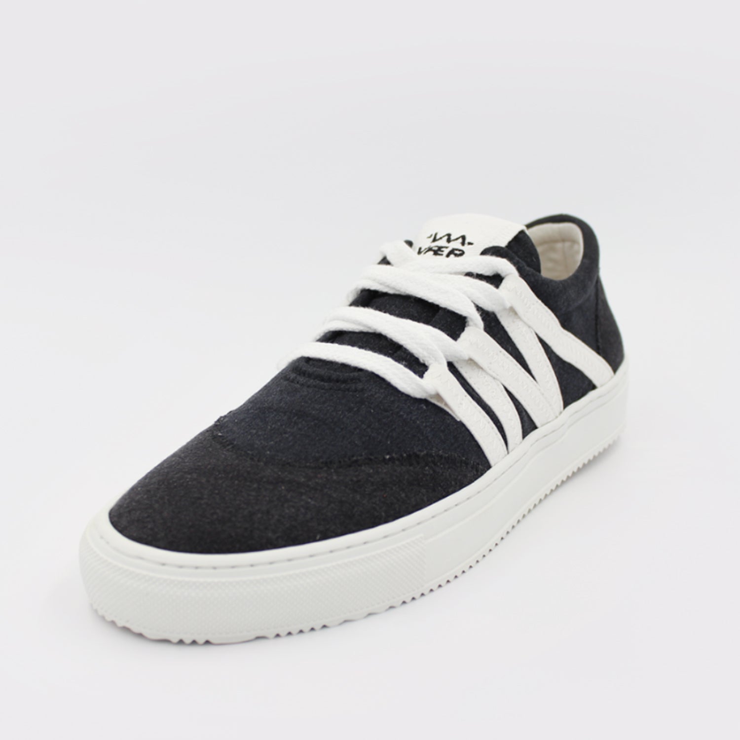 Black Phoenix shoes made from upcycled jeans and tablecloths, featuring a bold black and white design.