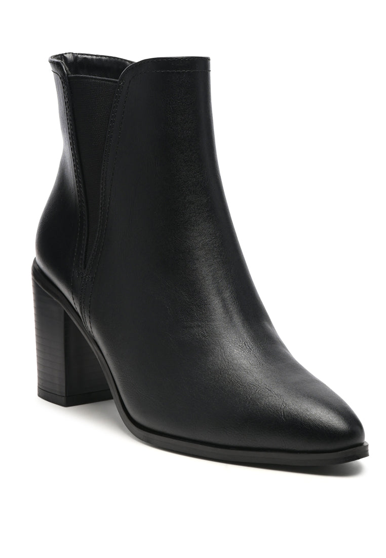 A pair of stylish block heeled Chelsea boots in black PU material, featuring a closed pointed toe and a sturdy block heel, perfect for autumn wear.