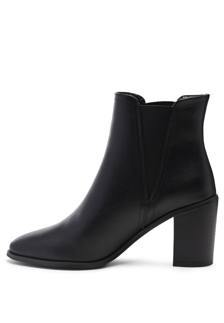 A pair of stylish block heeled Chelsea boots in black PU material, featuring a closed pointed toe and a sturdy block heel, perfect for autumn wear.