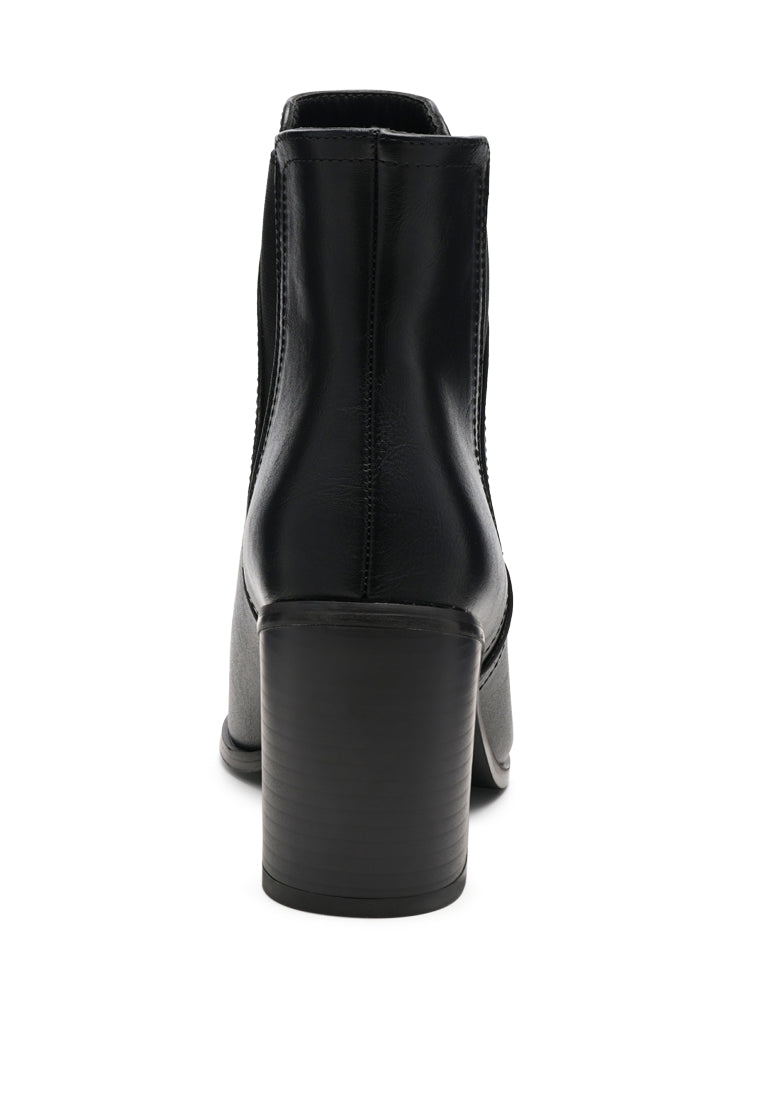 A pair of stylish block heeled Chelsea boots in black PU material, featuring a closed pointed toe and a sturdy block heel, perfect for autumn wear.