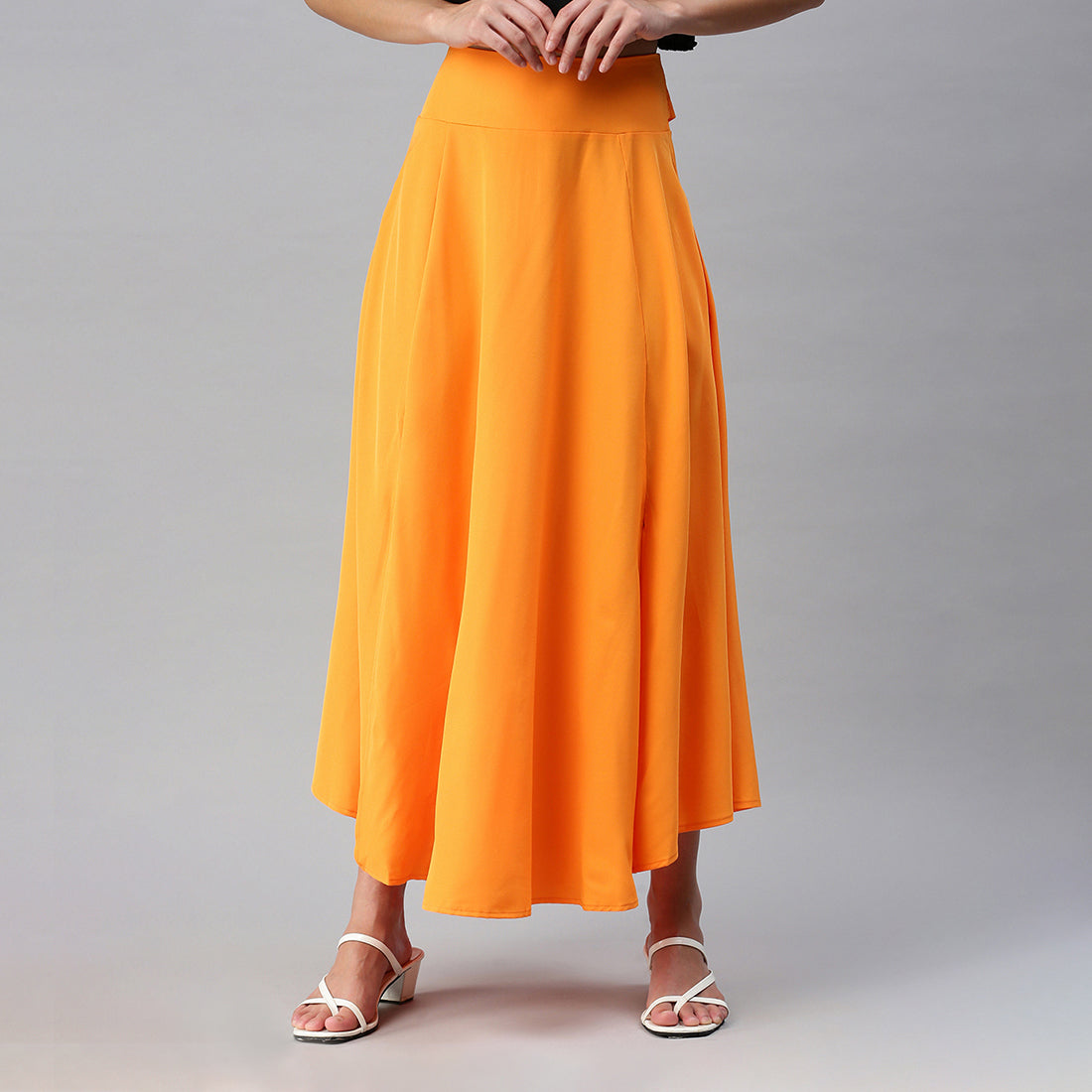 A stylish Bow Detail Slit Long Skirt featuring elegant bows, a mid-rise fit, and a hidden side zipper, perfect for casual and formal occasions.