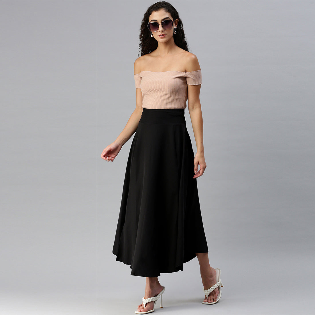 A stylish Bow Detail Slit Long Skirt featuring elegant bows, a mid-rise fit, and a hidden side zipper, perfect for casual and formal occasions.