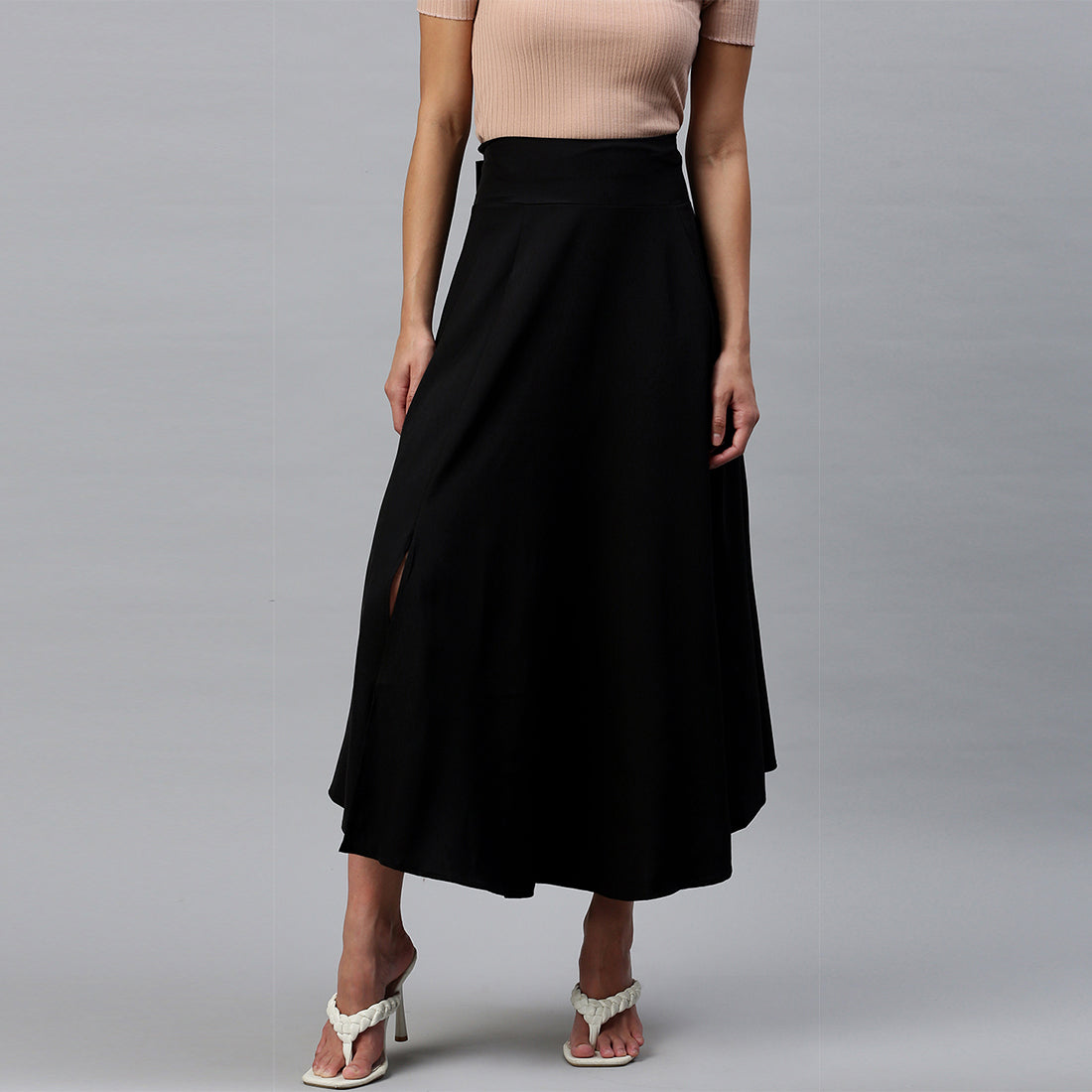 A stylish Bow Detail Slit Long Skirt featuring elegant bows, a mid-rise fit, and a hidden side zipper, perfect for casual and formal occasions.