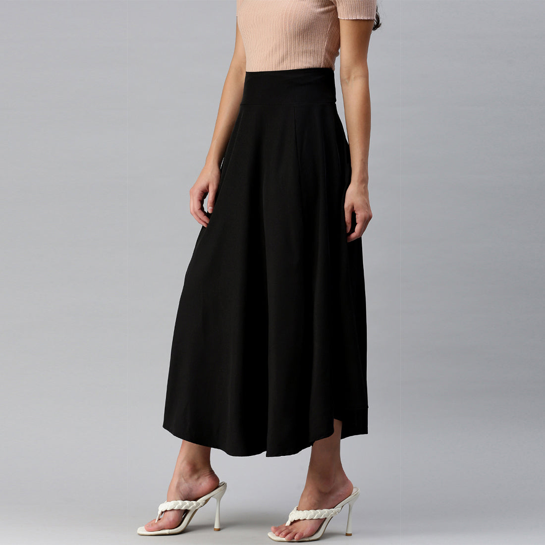 A stylish Bow Detail Slit Long Skirt featuring elegant bows, a mid-rise fit, and a hidden side zipper, perfect for casual and formal occasions.