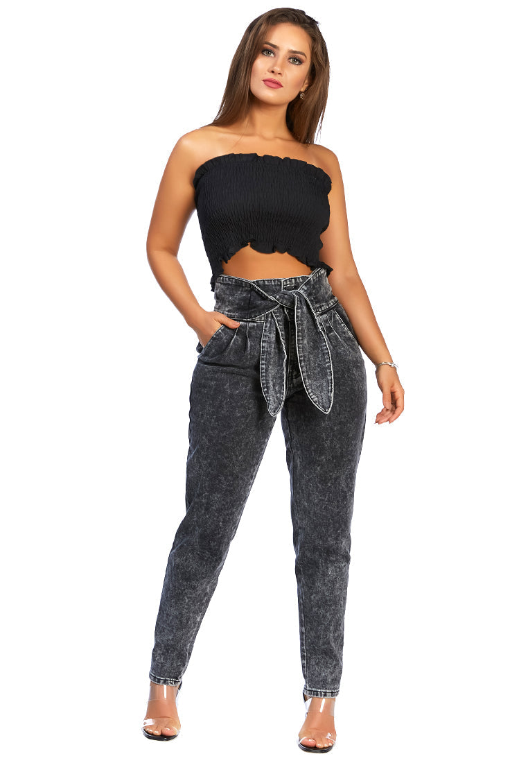 A pair of Bow Together Washed Denim Pants featuring a trendy paper bag waist, relaxed fit, and pleats, displayed on a neutral background.