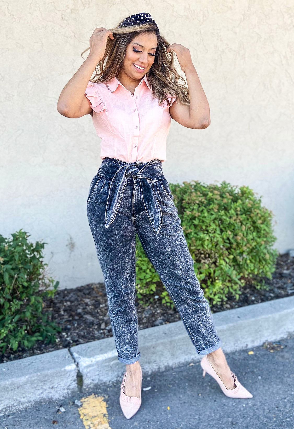 A pair of Bow Together Washed Denim Pants featuring a trendy paper bag waist, relaxed fit, and pleats, displayed on a neutral background.