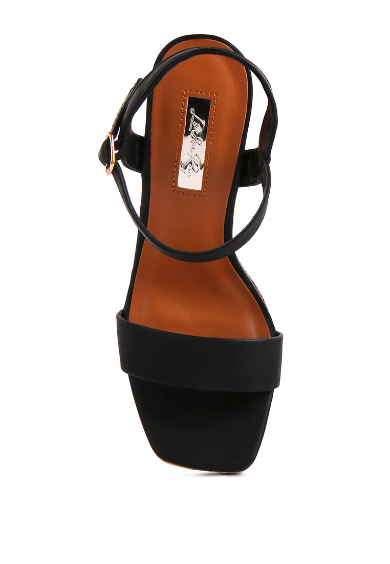 Buxor Woven Textured High Block Heeled Sandals featuring a stylish woven design, open square toe, and pin buckle closure.