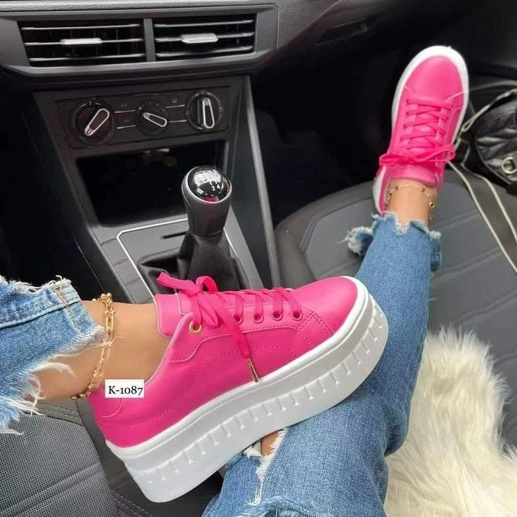 A pair of stylish Casual Platform Women's Shoes in a trendy design, showcasing their flat sneaker style and comfortable fit.