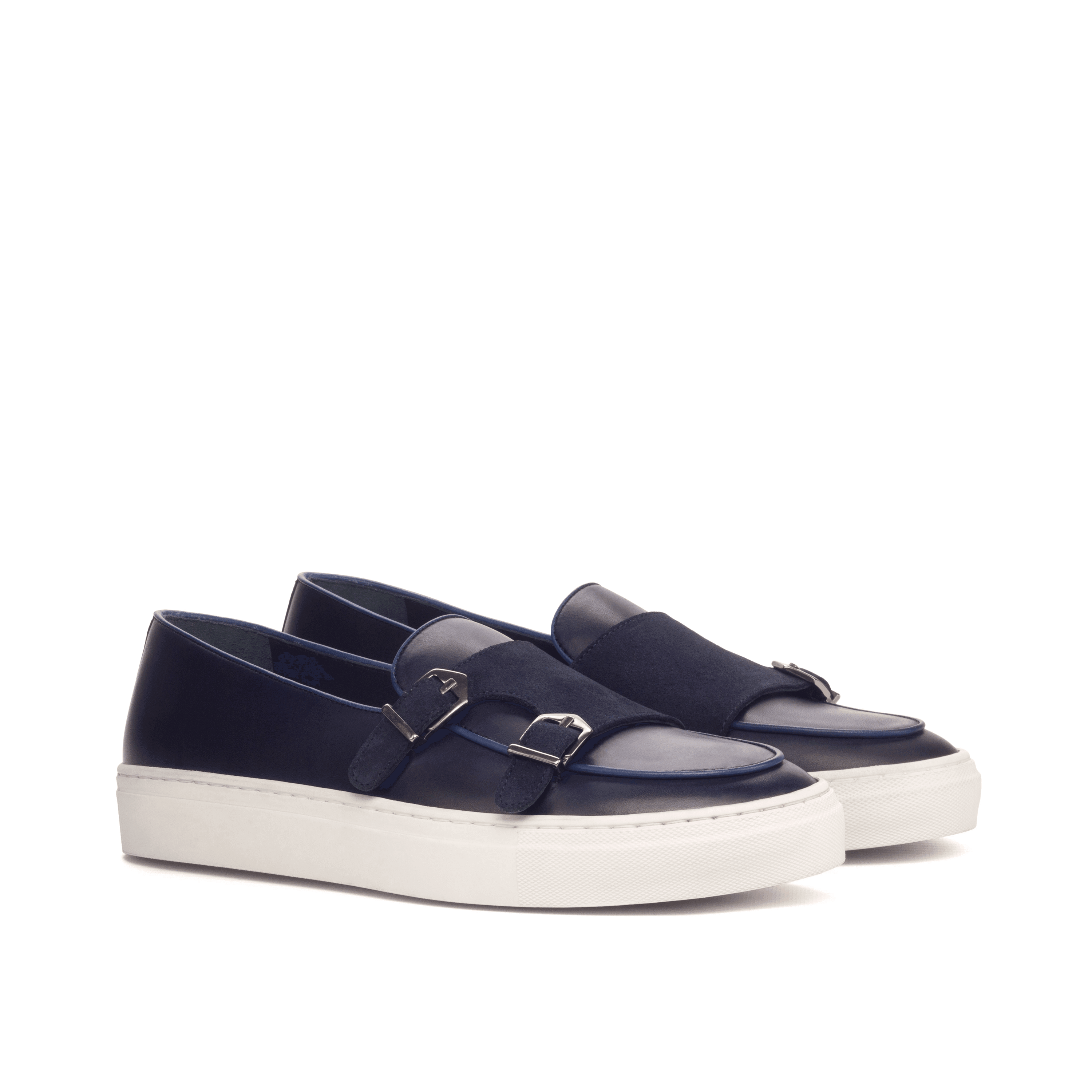 Celsus Monk Sneaker II featuring a double monk strap design with a white and black cupsole, crafted from premium navy and black leather materials.