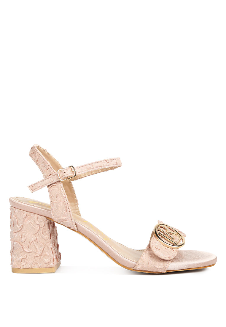 Chaplet Textured Block Heel Sandals featuring a satin upper, block heel, and pin buckle closure, perfect for stylish comfort.