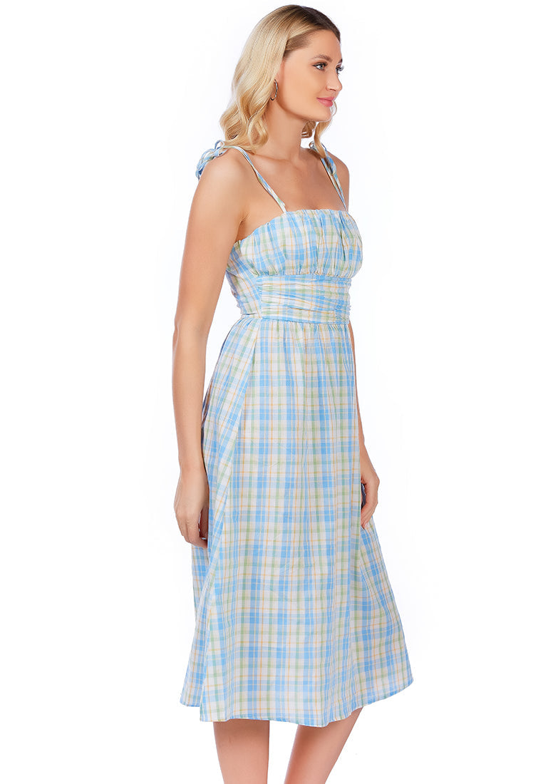 A stylish checkered midi slip dress with tie-up straps and a wrapped waist, made from 100% cotton, perfect for casual outings.