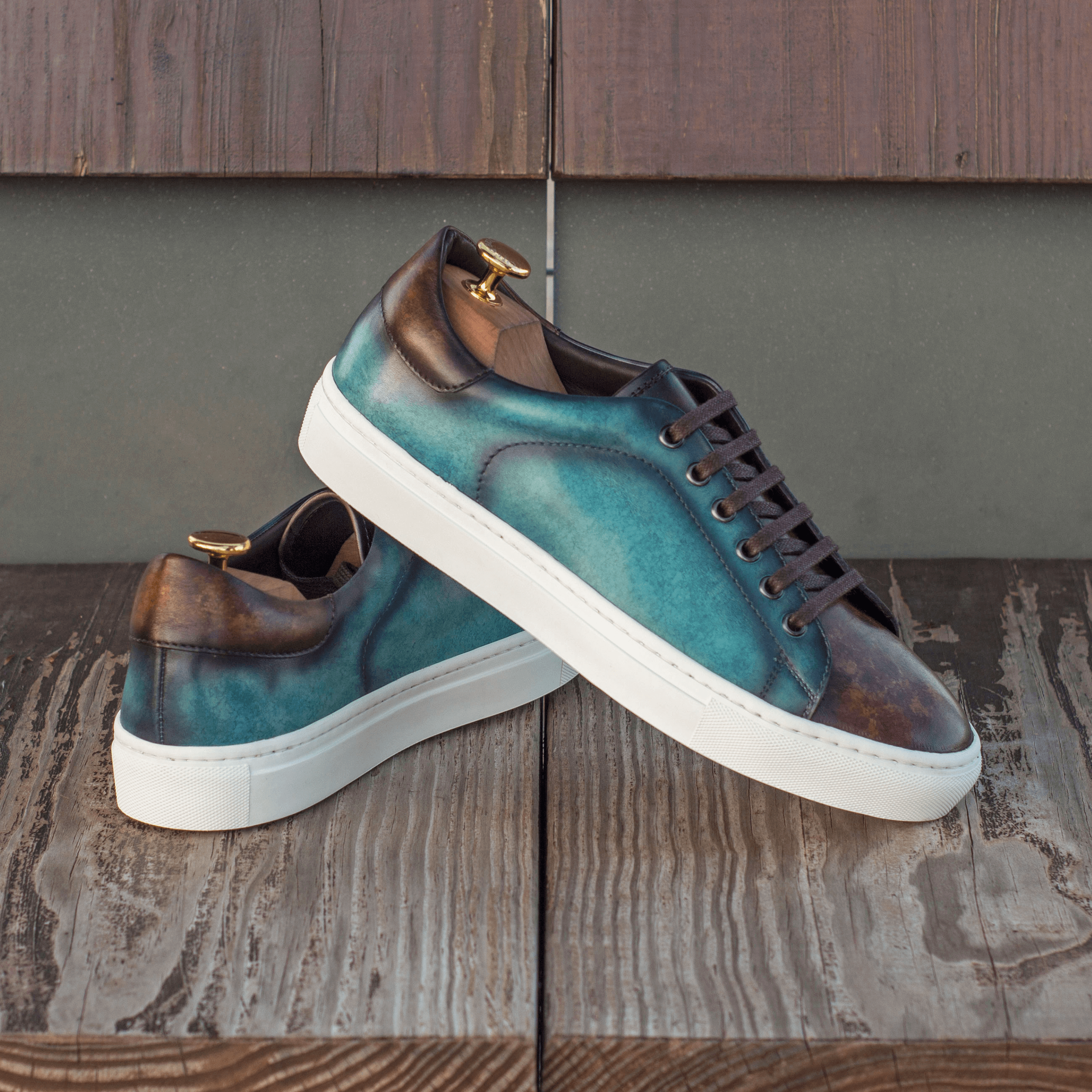 Chochmo Trainer Sneaker II featuring turquoise marble and brown crust patina, with a white cupsole rubber sole, perfect for casual wear.