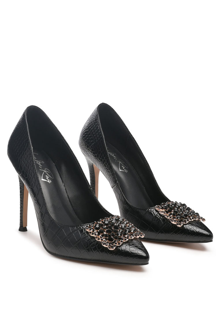 Cirrus Diamante Embellished Brooch Pumps featuring faux leather upper, stiletto heel, and sparkling diamante brooch detail.