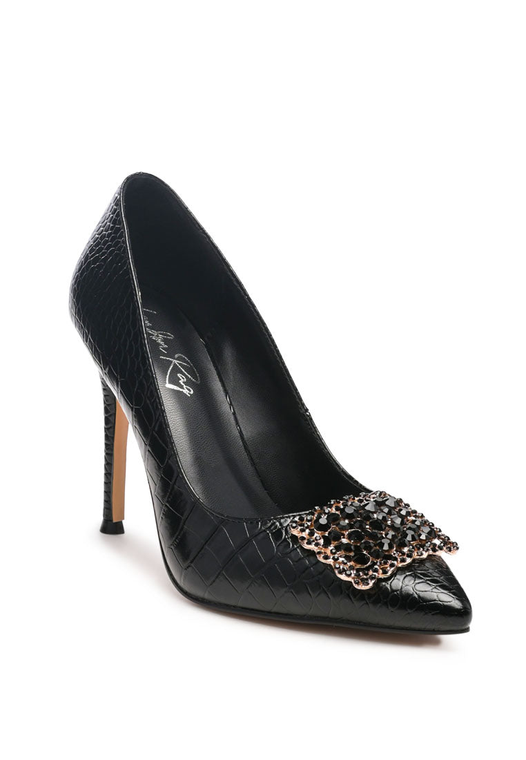 Cirrus Diamante Embellished Brooch Pumps featuring faux leather upper, stiletto heel, and sparkling diamante brooch detail.