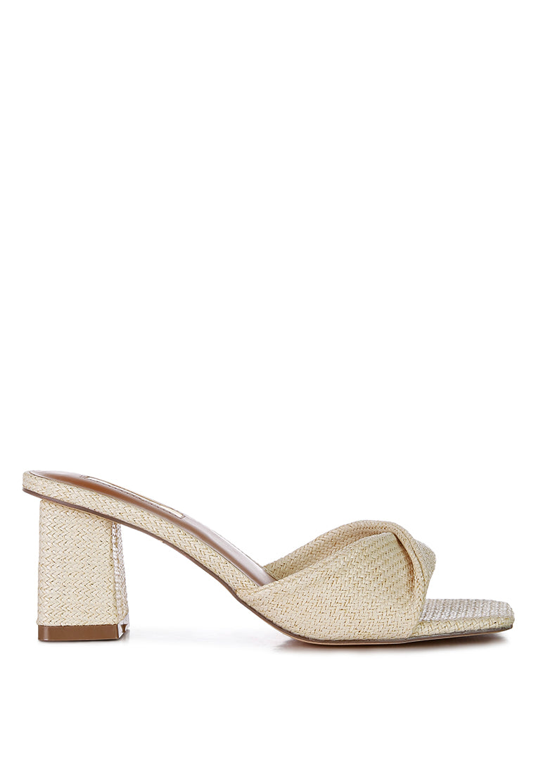 Cityscape Block Heel Slip-On Sandals featuring a stylish faux leather twisted strap and open square toe design.