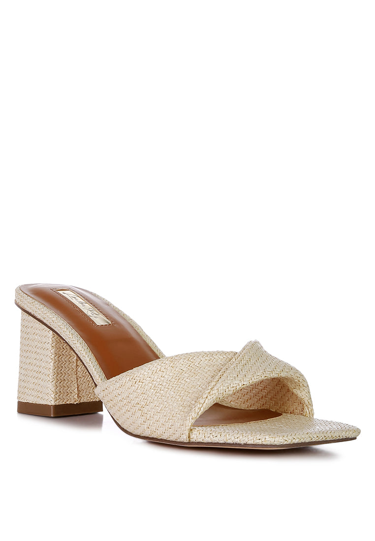 Cityscape Block Heel Slip-On Sandals featuring a stylish faux leather twisted strap and open square toe design.