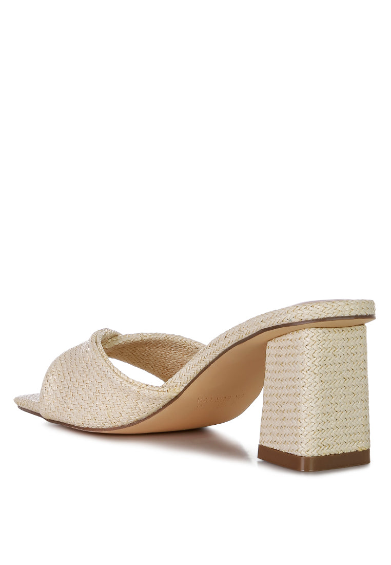 Cityscape Block Heel Slip-On Sandals featuring a stylish faux leather twisted strap and open square toe design.