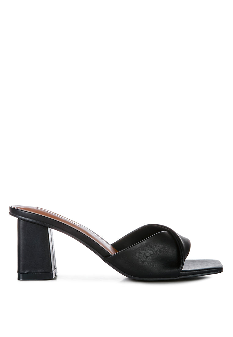 Cityscape Block Heel Slip-On Sandals featuring a stylish faux leather twisted strap and open square toe design.