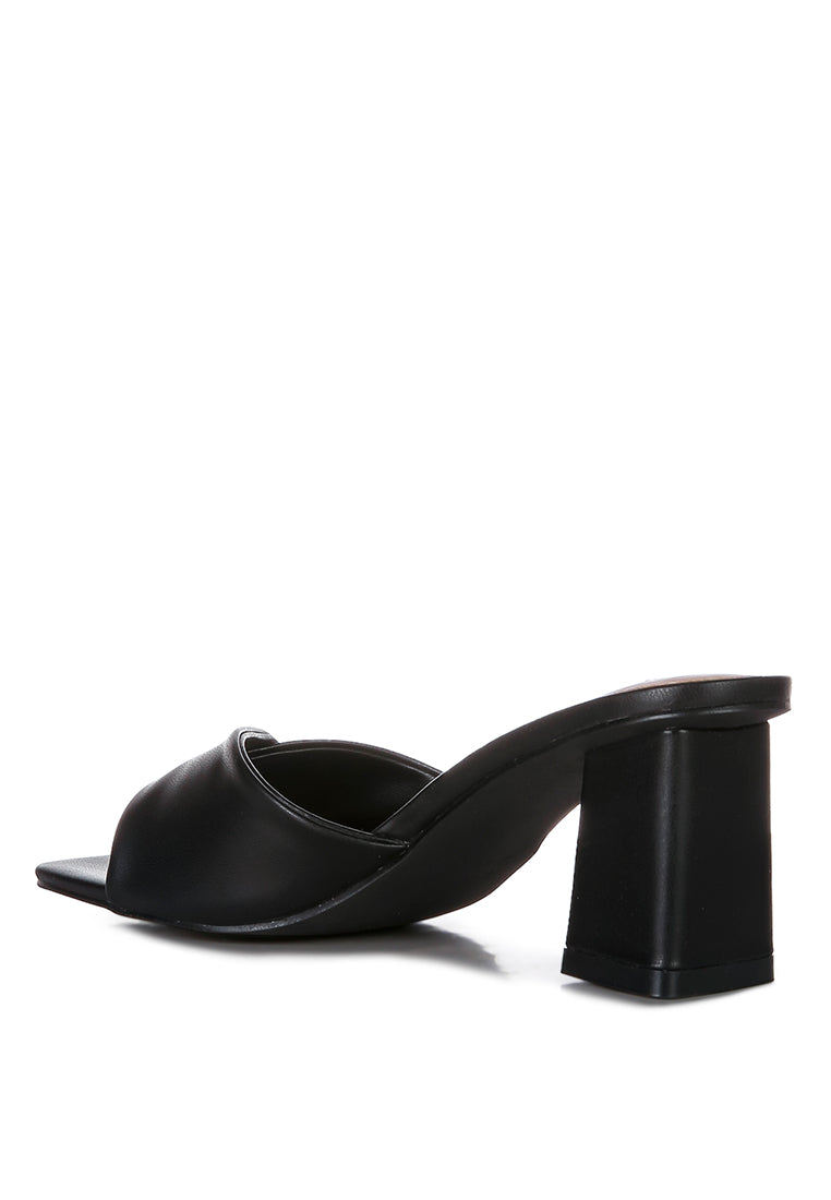 Cityscape Block Heel Slip-On Sandals featuring a stylish faux leather twisted strap and open square toe design.