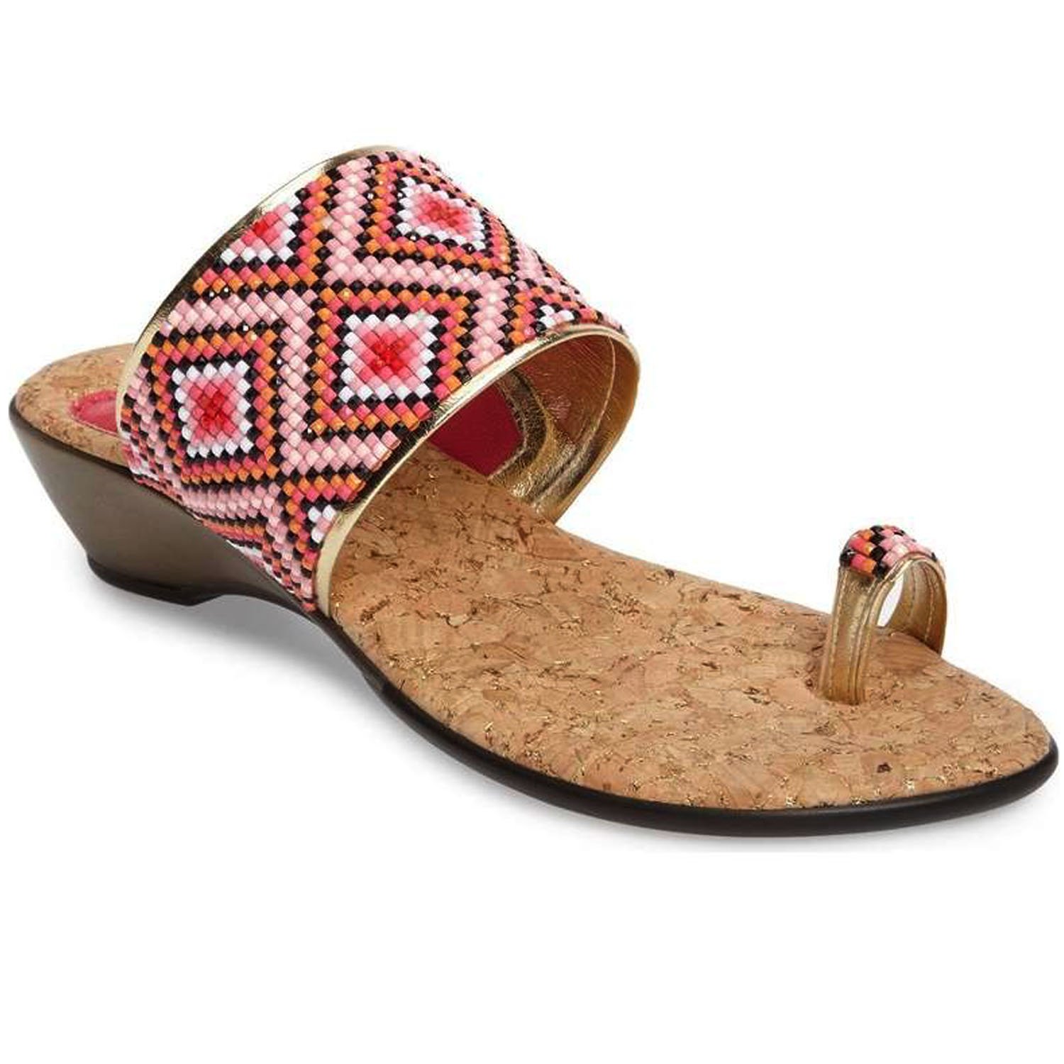 Coastal sandals featuring a diamond patterned leather upper, memory foam padding, and a low wedge outsole, perfect for summer outings.