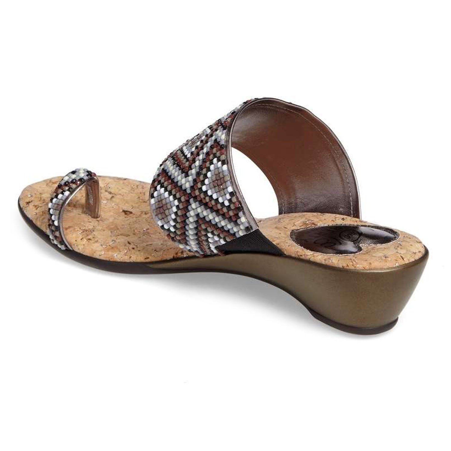 Coastal sandals featuring a diamond patterned leather upper, memory foam padding, and a low wedge outsole, perfect for summer outings.