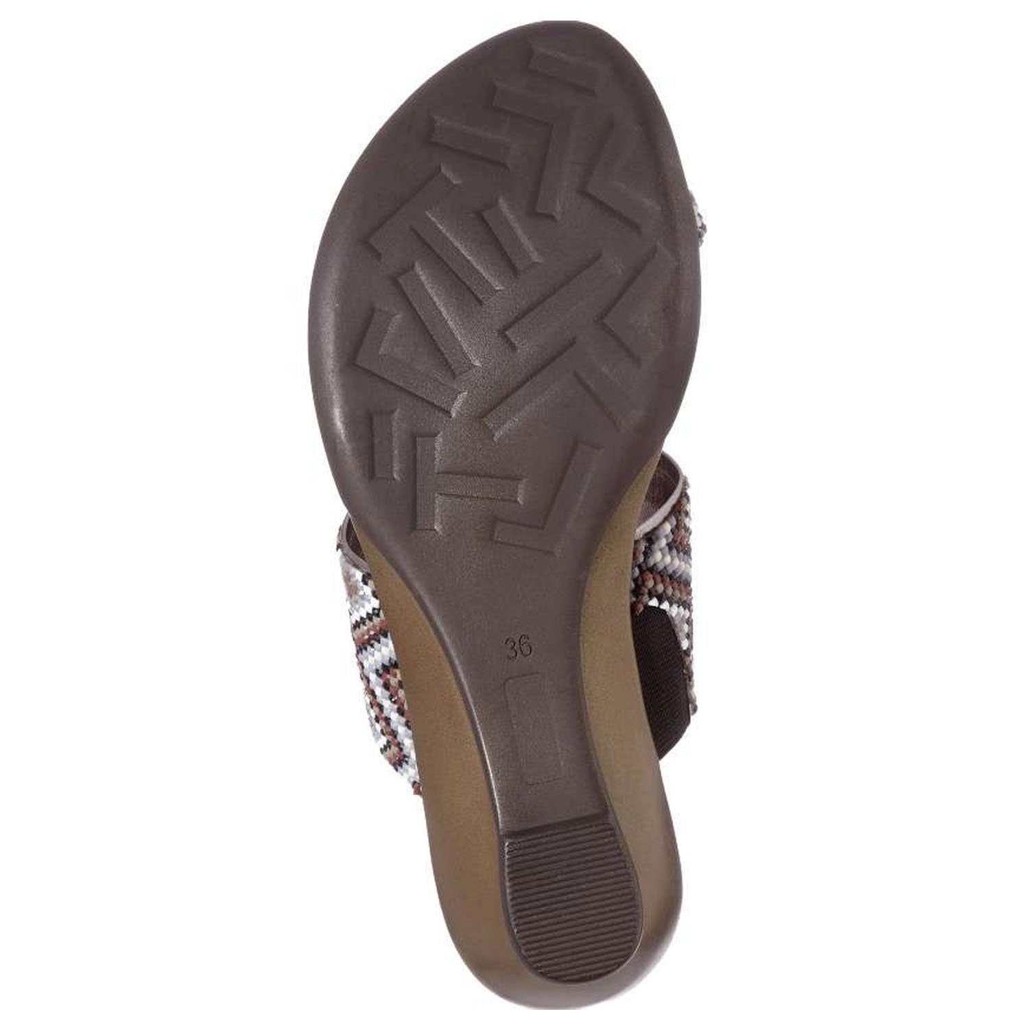 Coastal sandals featuring a diamond patterned leather upper, memory foam padding, and a low wedge outsole, perfect for summer outings.