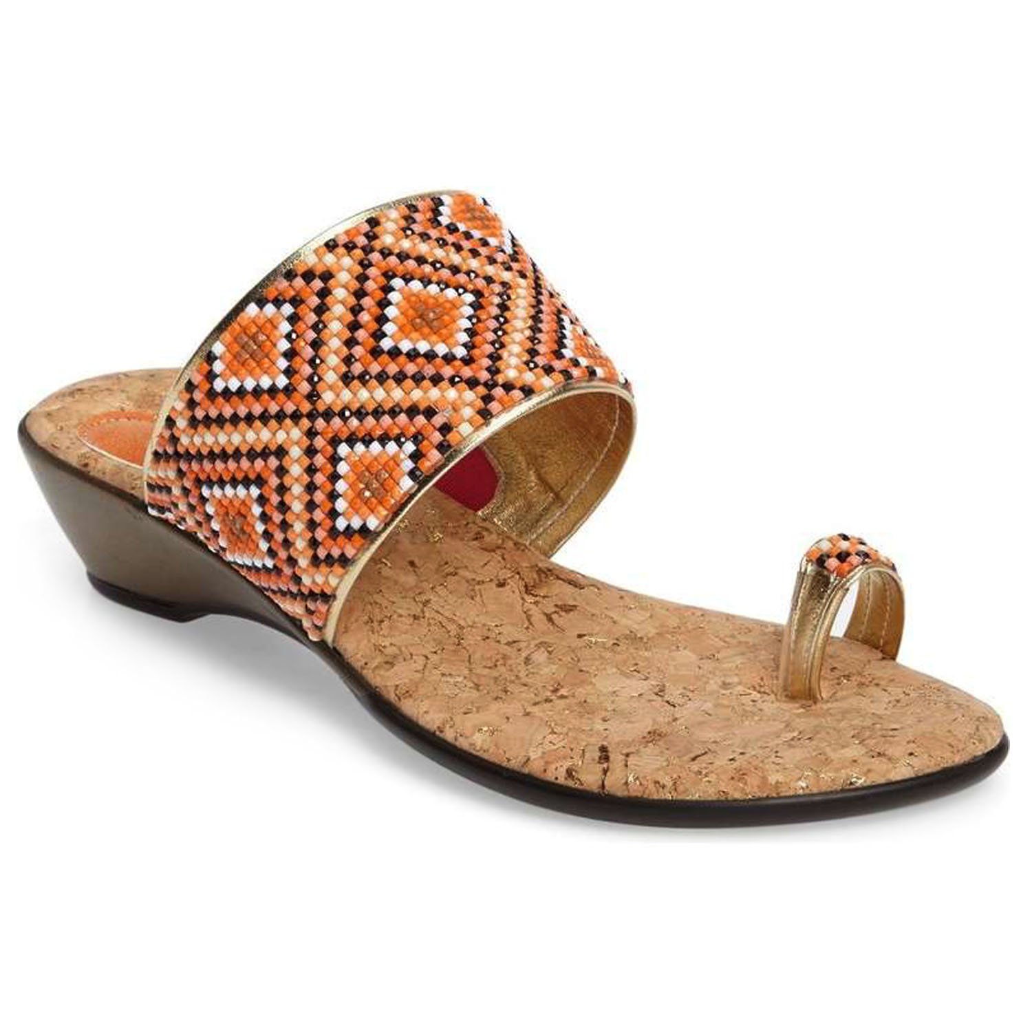 Coastal sandals featuring a diamond patterned leather upper, memory foam padding, and a low wedge outsole, perfect for summer outings.