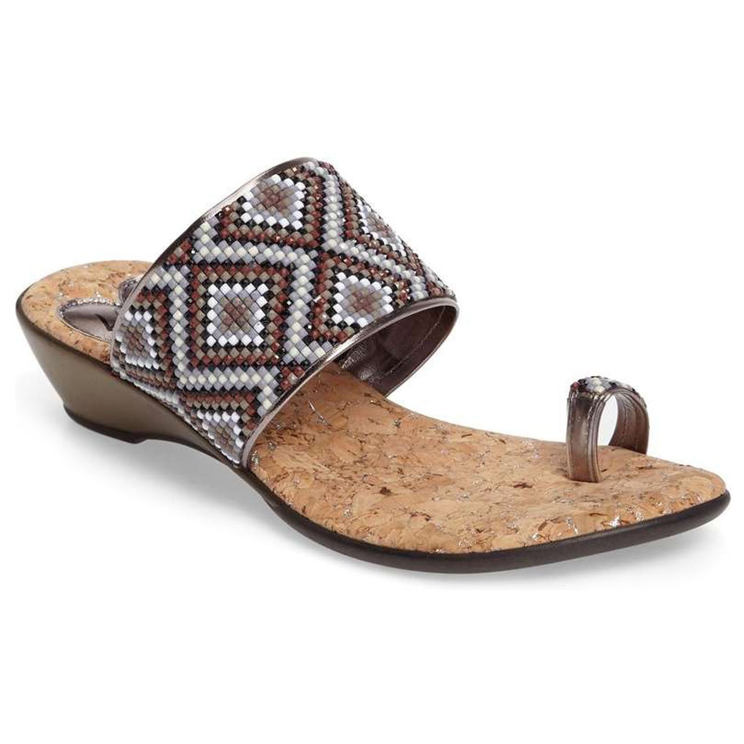 Coastal sandals featuring a diamond patterned leather upper, memory foam padding, and a low wedge outsole, perfect for summer outings.