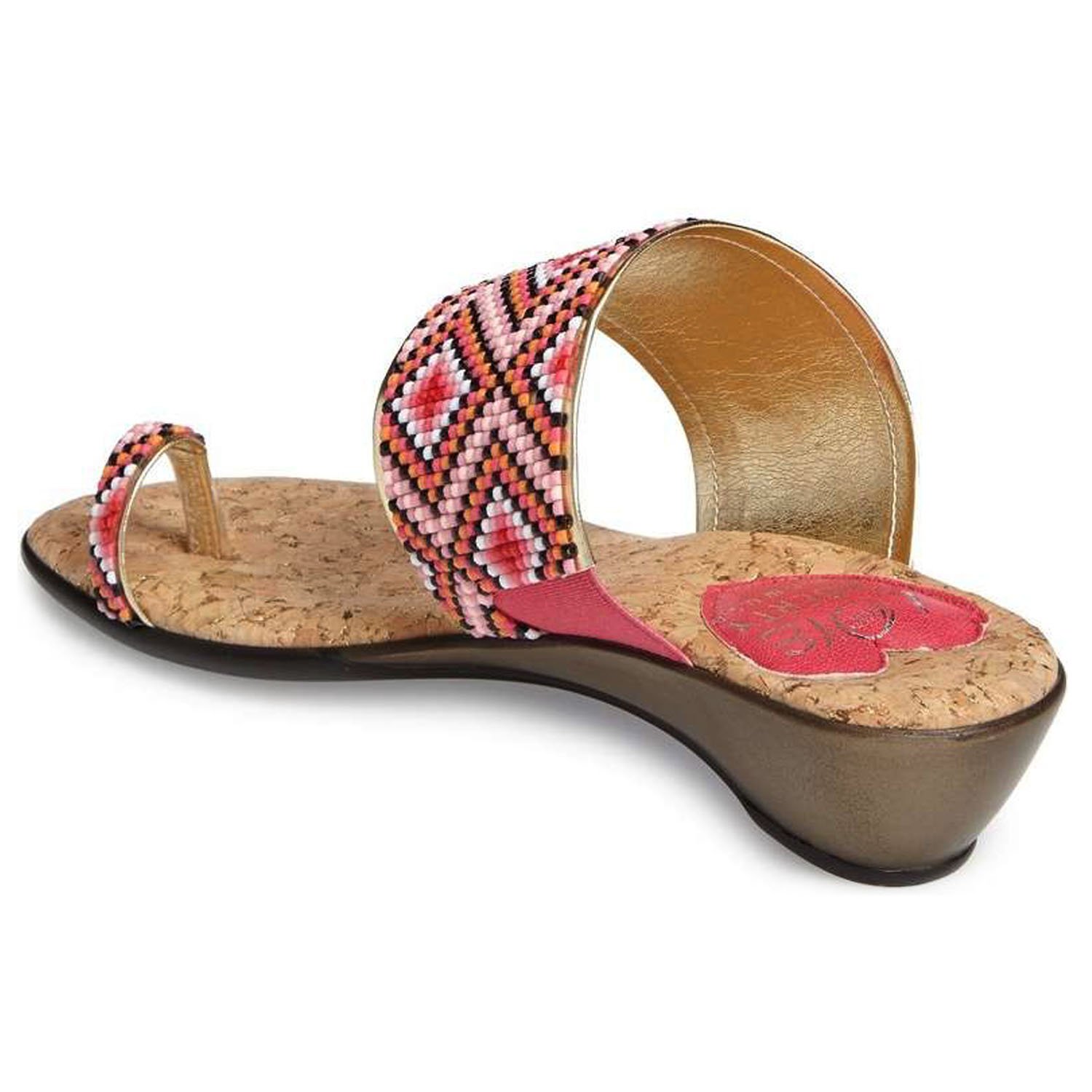 Coastal sandals featuring a diamond patterned leather upper, memory foam padding, and a low wedge outsole, perfect for summer outings.