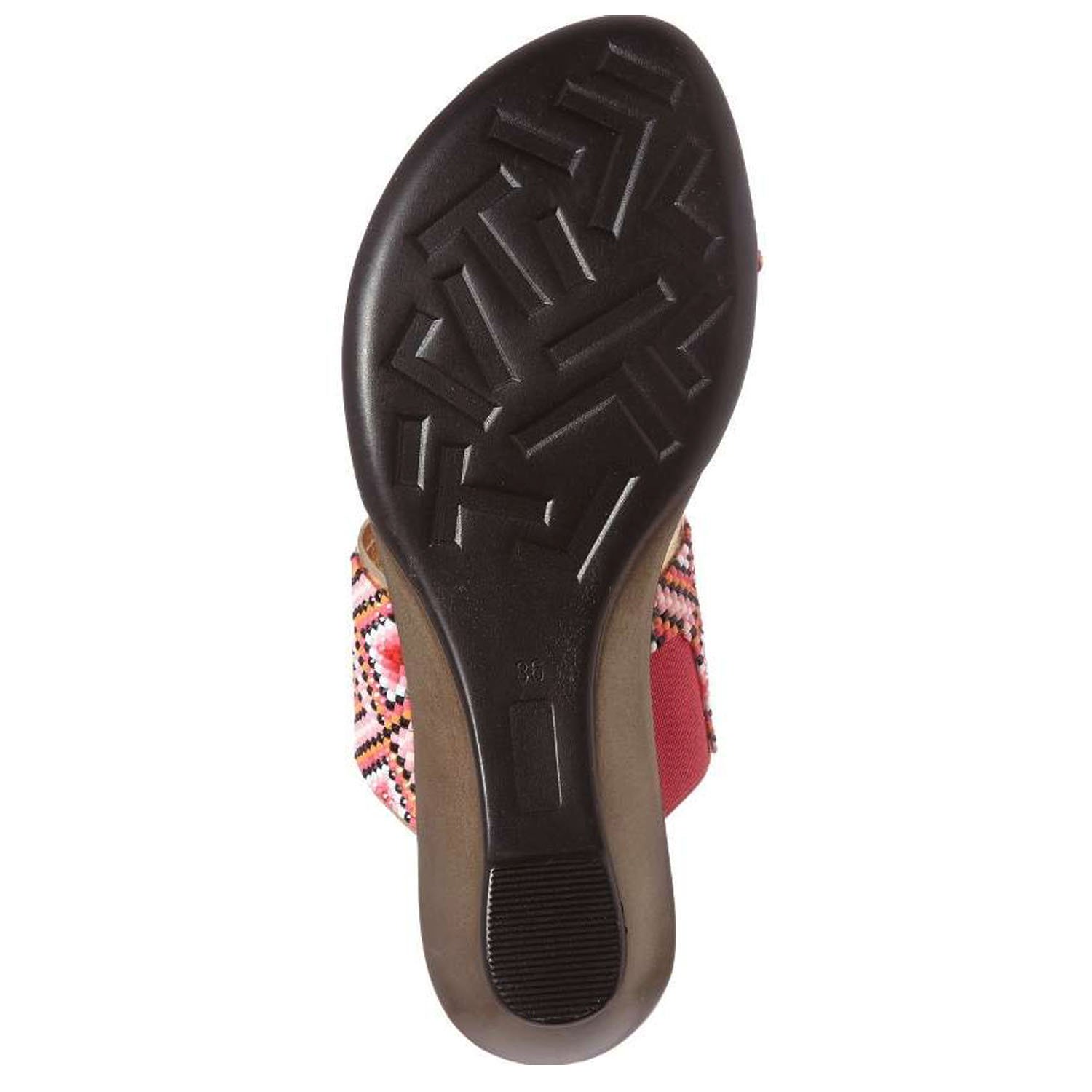 Coastal sandals featuring a diamond patterned leather upper, memory foam padding, and a low wedge outsole, perfect for summer outings.