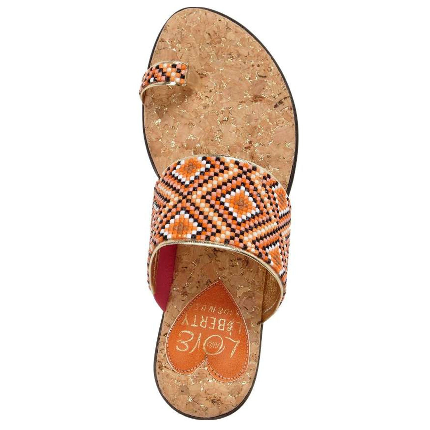 Coastal sandals featuring a diamond patterned leather upper, memory foam padding, and a low wedge outsole, perfect for summer outings.