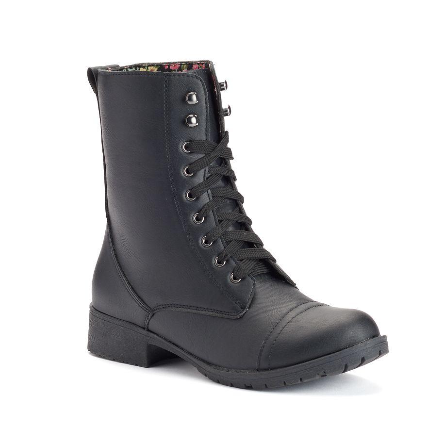 A pair of stylish COMBAT boots featuring a vegan upper, lace-up design, and slip-resistant outsole, perfect for various activities.