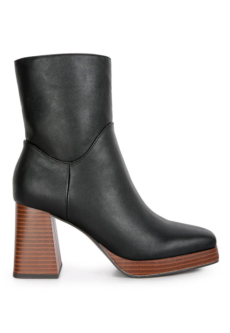 Couts High Ankle Heel Boots featuring a sleek patent PU exterior, cushioned insole, and stylish side zipper for easy wear.