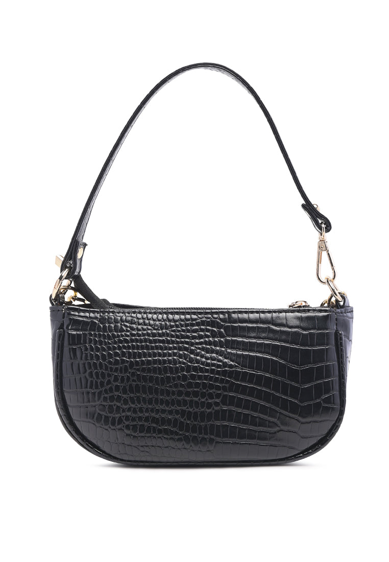 Stylish Croc Sling Bag in shiny faux leather with a detachable strap and zipped compartments, available in various colors.