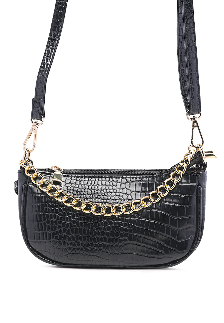 Stylish Croc Sling Bag in shiny faux leather with a detachable strap and zipped compartments, available in various colors.