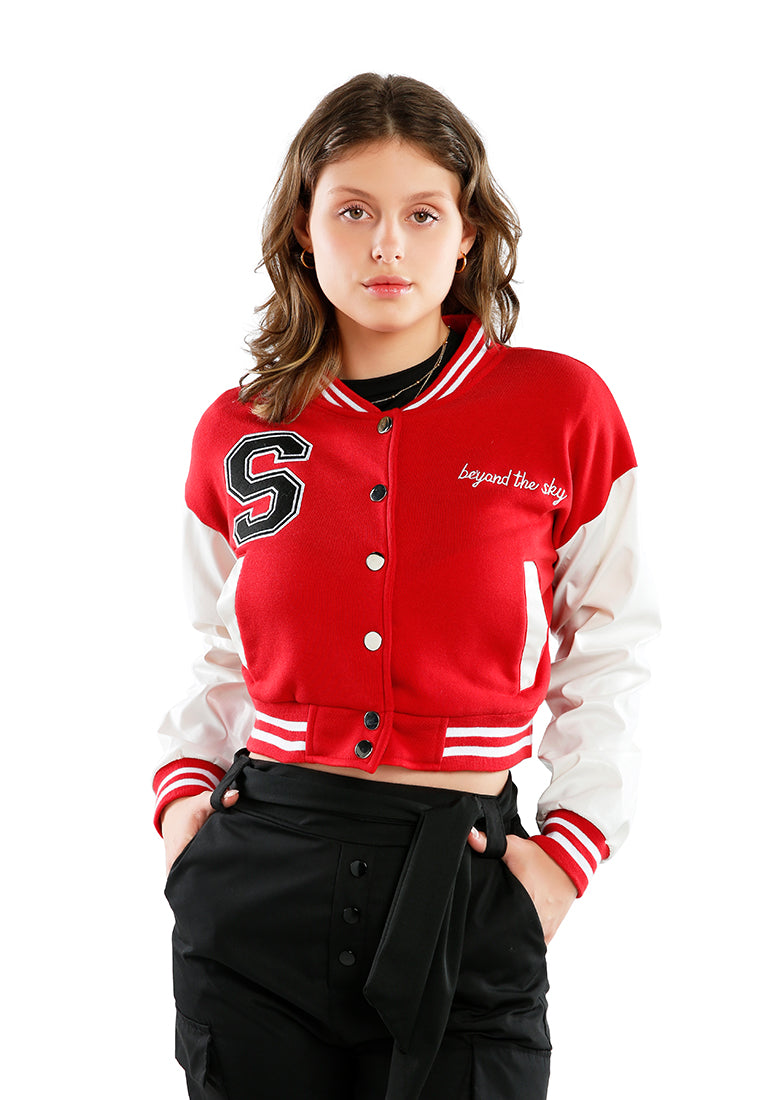 A stylish cropped varsity jacket featuring contrasting slash pockets and stripes, designed for a trendy look.