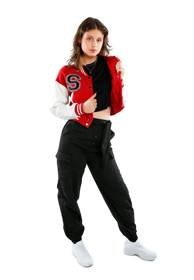 A stylish cropped varsity jacket featuring contrasting slash pockets and stripes, designed for a trendy look.