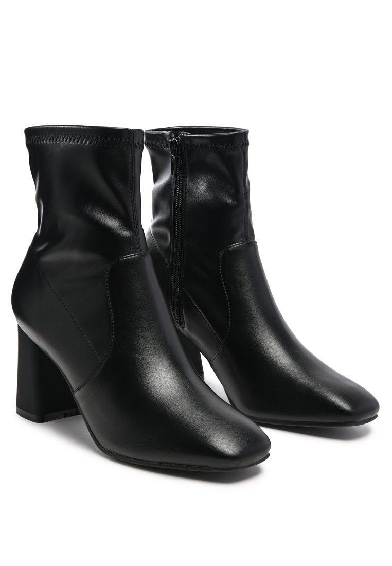 Daffofil Block Heeled Ankle Boots featuring faux leather, side zipper, and block heel design, perfect for winter fashion.