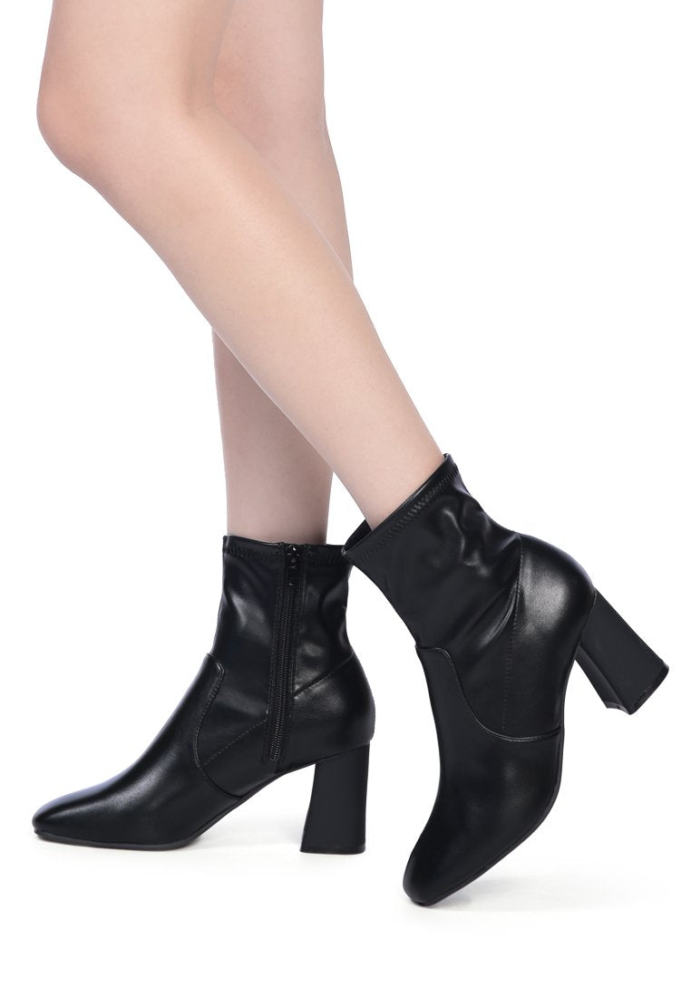 Daffofil Block Heeled Ankle Boots featuring faux leather, side zipper, and block heel design, perfect for winter fashion.