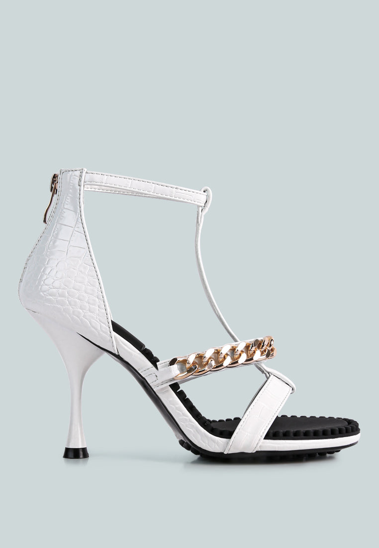 Dakota Metal Chain Mid Heel Sandals featuring a stylish T-strap design with a metal chain detail, available in black, white, and latte colors.