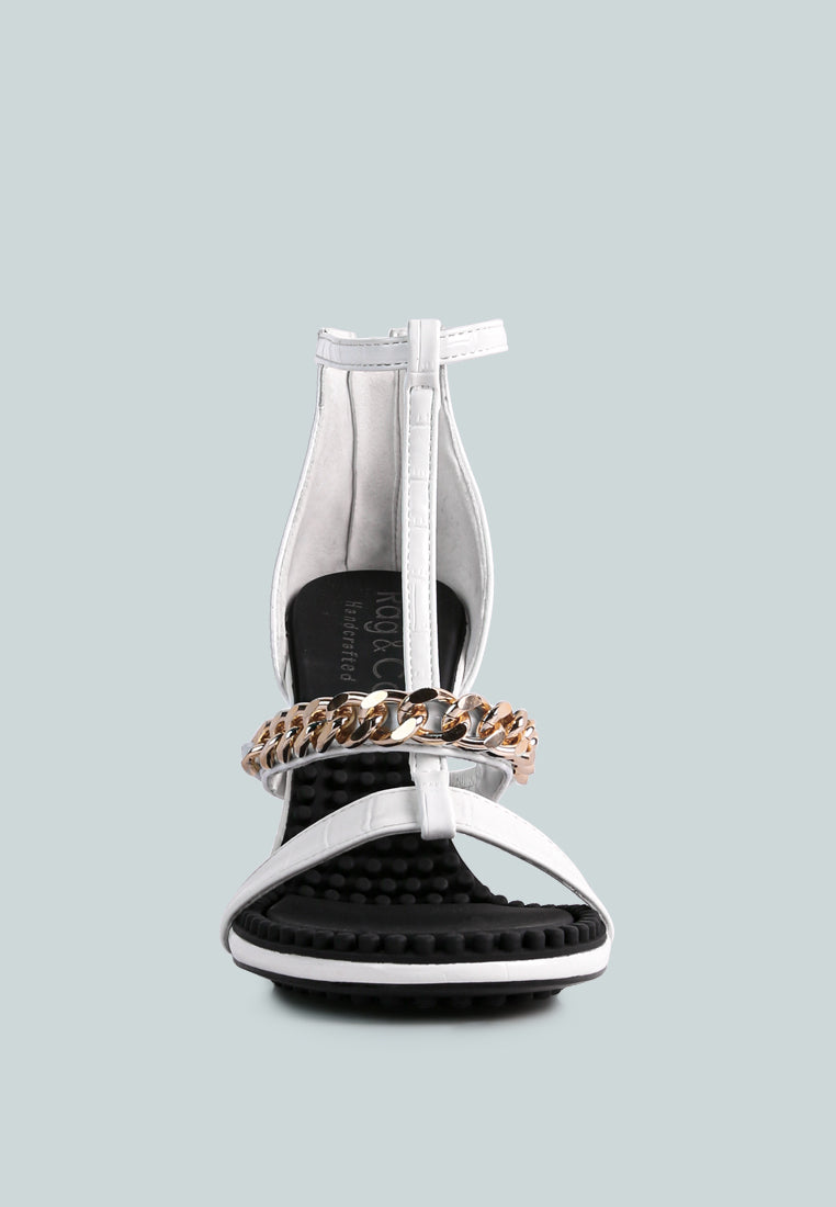 Dakota Metal Chain Mid Heel Sandals featuring a stylish T-strap design with a metal chain detail, available in black, white, and latte colors.