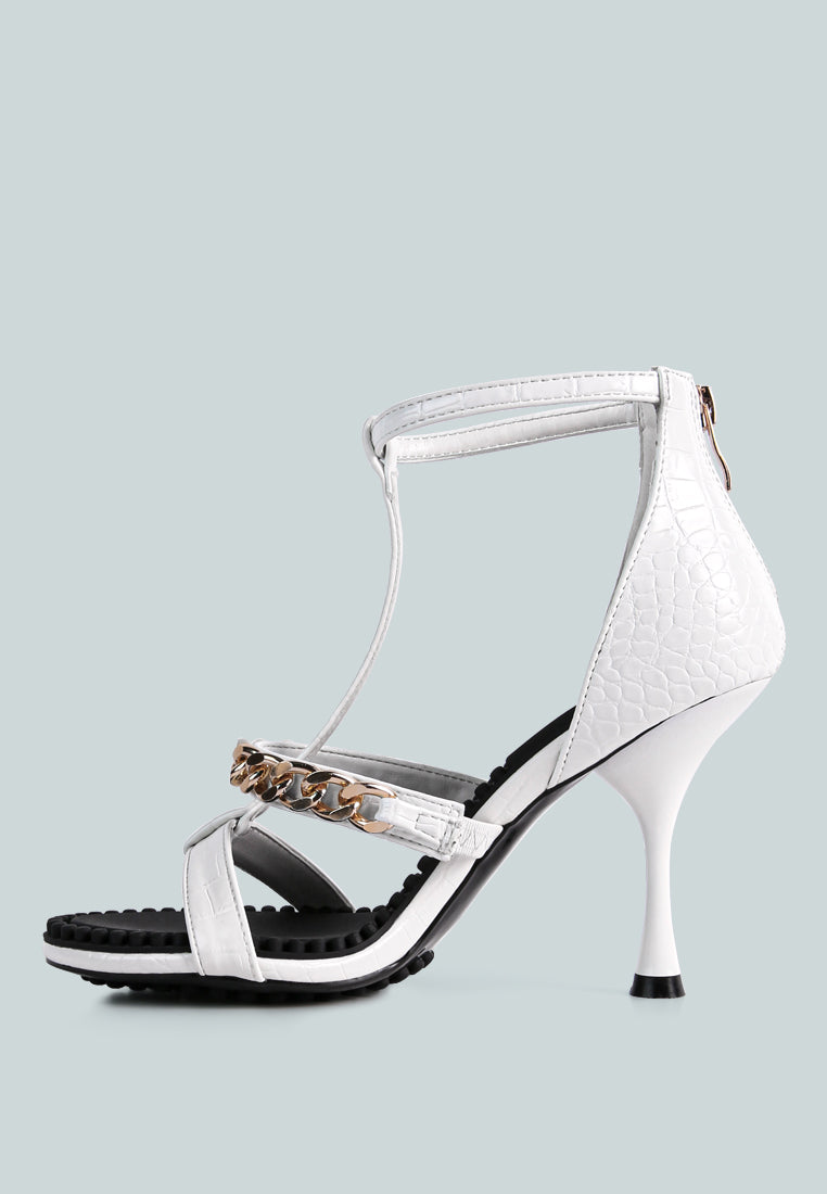 Dakota Metal Chain Mid Heel Sandals featuring a stylish T-strap design with a metal chain detail, available in black, white, and latte colors.